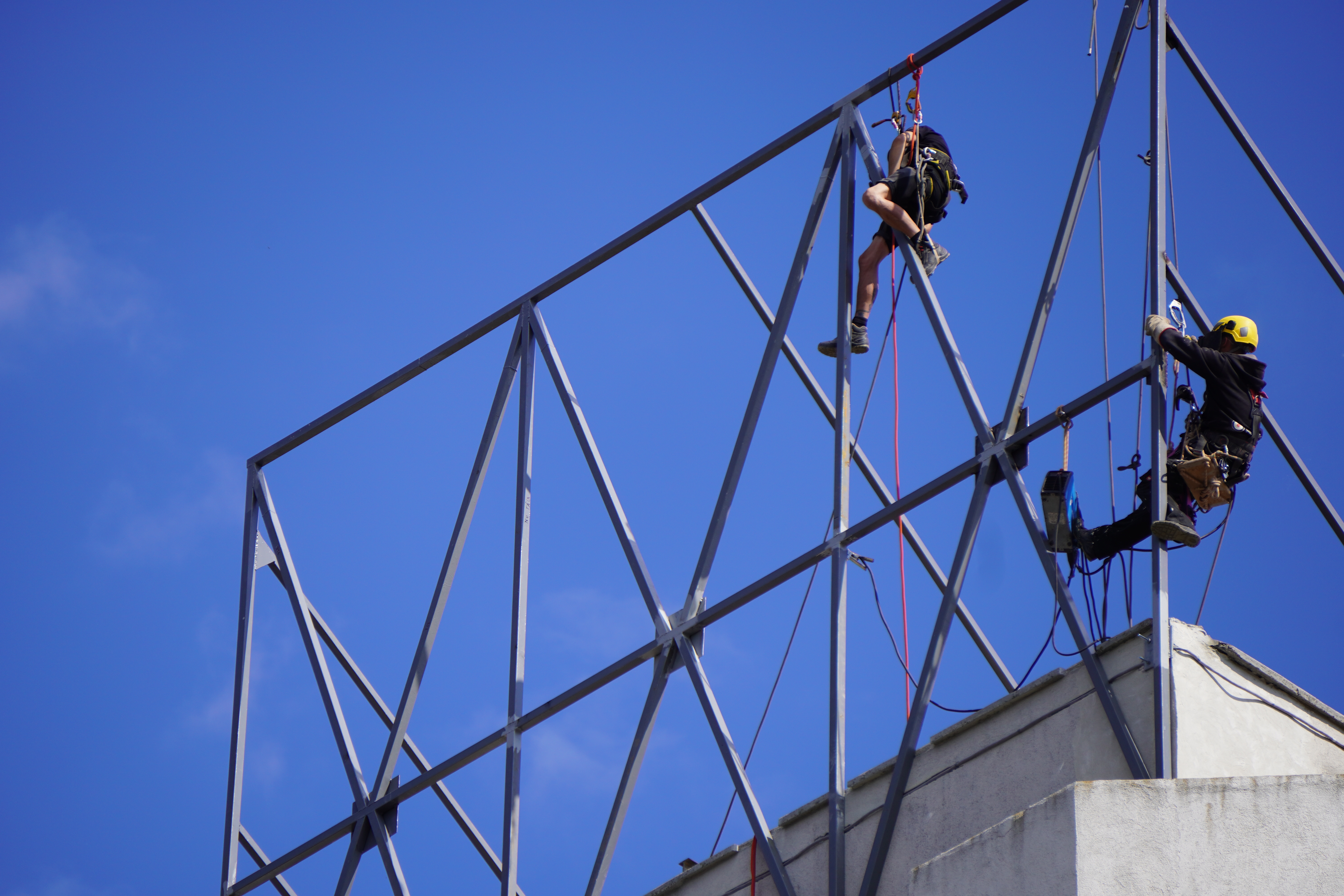 A couple of workers high above ground